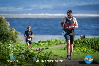 Runners at the Minehead Triathon with views across the bay