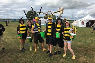 Volunteers dressed as bees with collection buckets