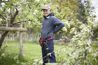 Martin stands in a garden