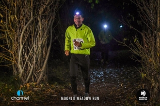 Runners with head torches at the Moonlit Meadow Run