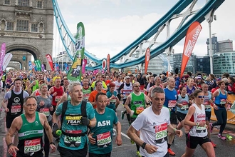 London marathon runners crossing London Bridge