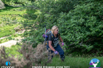 Becky hiking up a steep hill at the Exmoor Perambulation