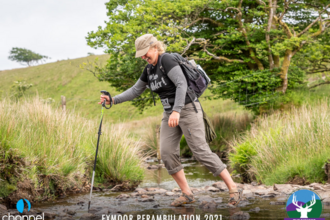 Becky crossing a river at the Exmoor Perambulation