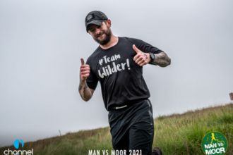 Team Wilder Fundraiser giving the thumbs up running across Exmoor