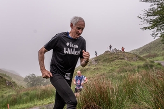 Team Wilder runner running through the hills of Exmoor