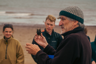 Mark Ward addressing a group of volunteers at a Shoresearch event at Dunster beach