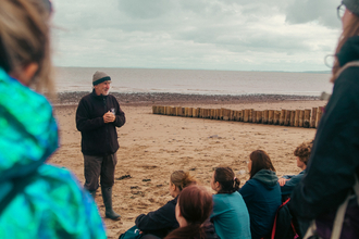 Mark Ward addressing a group of volunteers at a Shoresearch event at Dunster beach