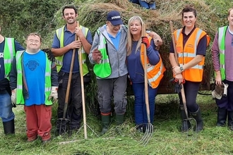 Carymoor volunteers with an education group