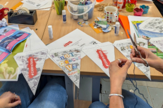 Two women making bunting for Lobby Week