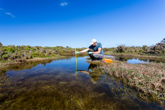 A man collecting water samples