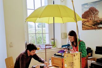 Beth Calverley of The Poetry Machine with a member of staff at Somerset Wildlife Trust