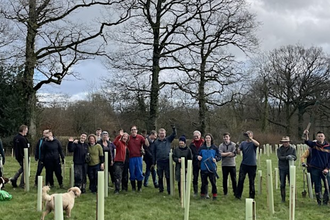 A group of people gathered together after a tree planting day