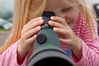 Toddler with monocular Peter Cairns