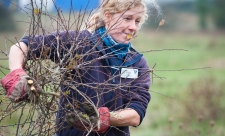 Woman clearing scrub