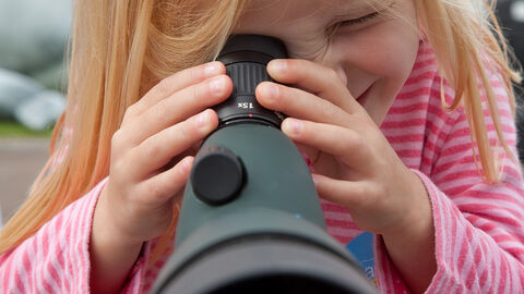 Toddler with monocular Peter Cairns