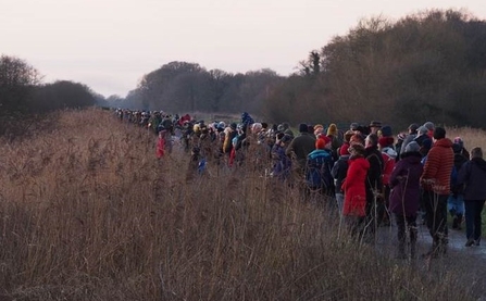 Crowds of people at Avalon Marshes waiting for starlings