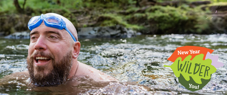 A man swimming in a river