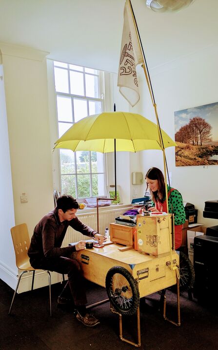 Beth Calverley of The Poetry Machine with a member of staff at Somerset Wildlife Trust