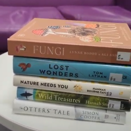 Nature books in a pile at Taunton Library