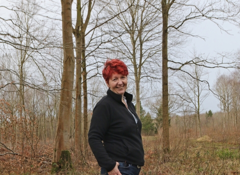 Anne standing in a woodland