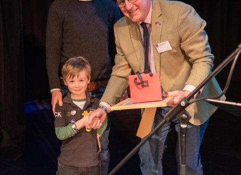 Jack Davies and his father receive the award from Graeme Mitchell, Chair of SWT