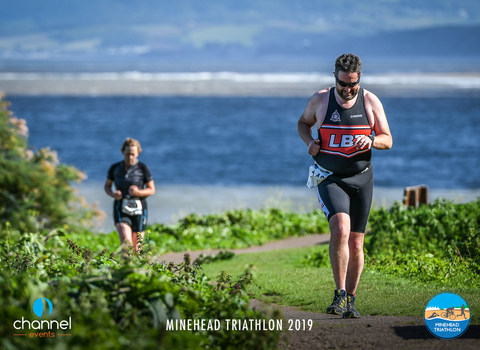Runners at the Minehead Triathon with views across the bay