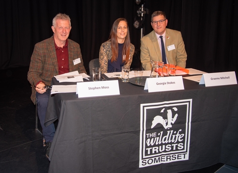 Stephen Moss, Georgia Stokes and Graeme Mitchell seated at AGM in 2019