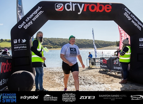 Liz crossing the finish line at the exmoor swim