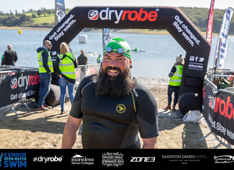 Marek looking very happy at the finish line of the Exmoor Swim