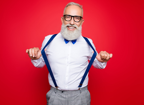 Happy bearded man with blue bowtie and braces with the text Look Sharp for Hedgehogs!