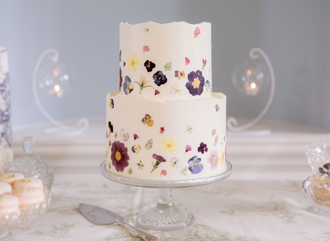 Stunning celebration cake covered in pressed flowers