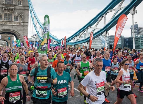 London marathon runners crossing London Bridge