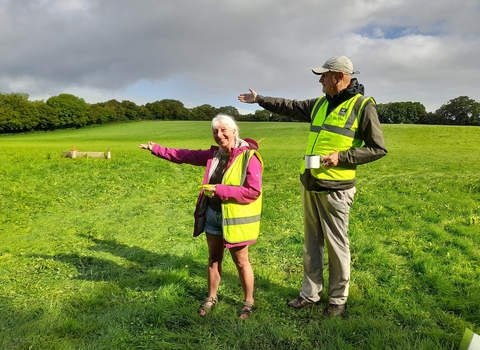 Two volunteers marshalling a car park