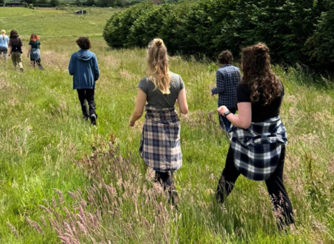 Wilder Youth members walking through a field