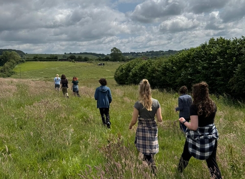 Members of the Youth Forum walking through a field