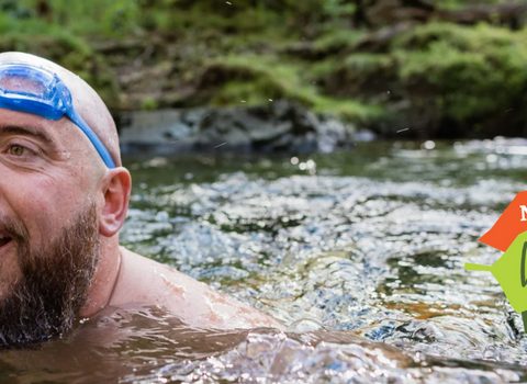 A man swimming in a river