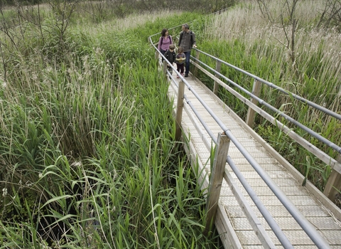 family walking along bridge at westhay